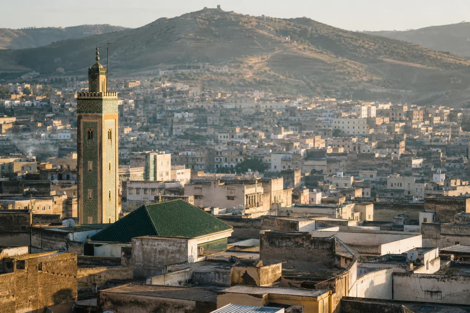 The green-tiled minaret and rooftops of the Fes el-Bali medina