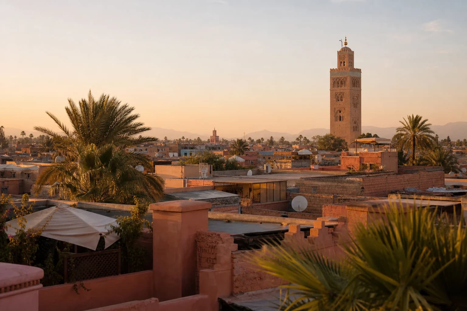 The Koutoubia minaret above Marrakech's ochre medina at golden hour
